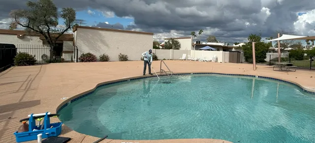 Splash Mob Pools technician servicing a commercial swimming pool in Arizona